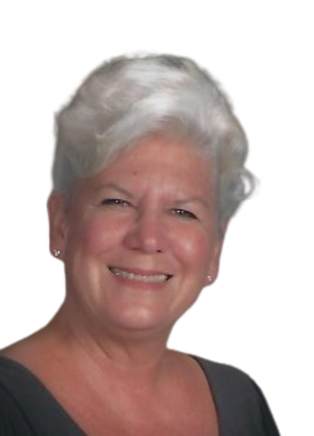 Smiling woman with short white hair.